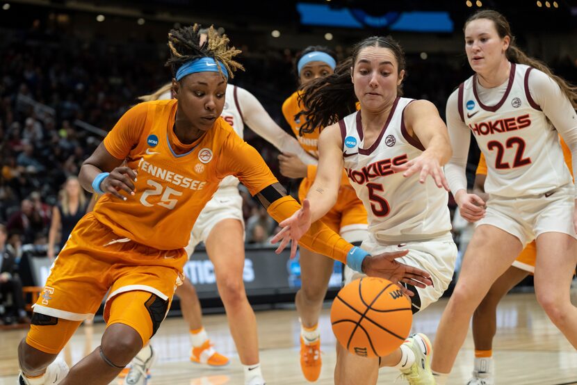 Tennessee guard Jordan Horston (25) and Virginia Tech guard Georgia Amoore (5) scramble for...