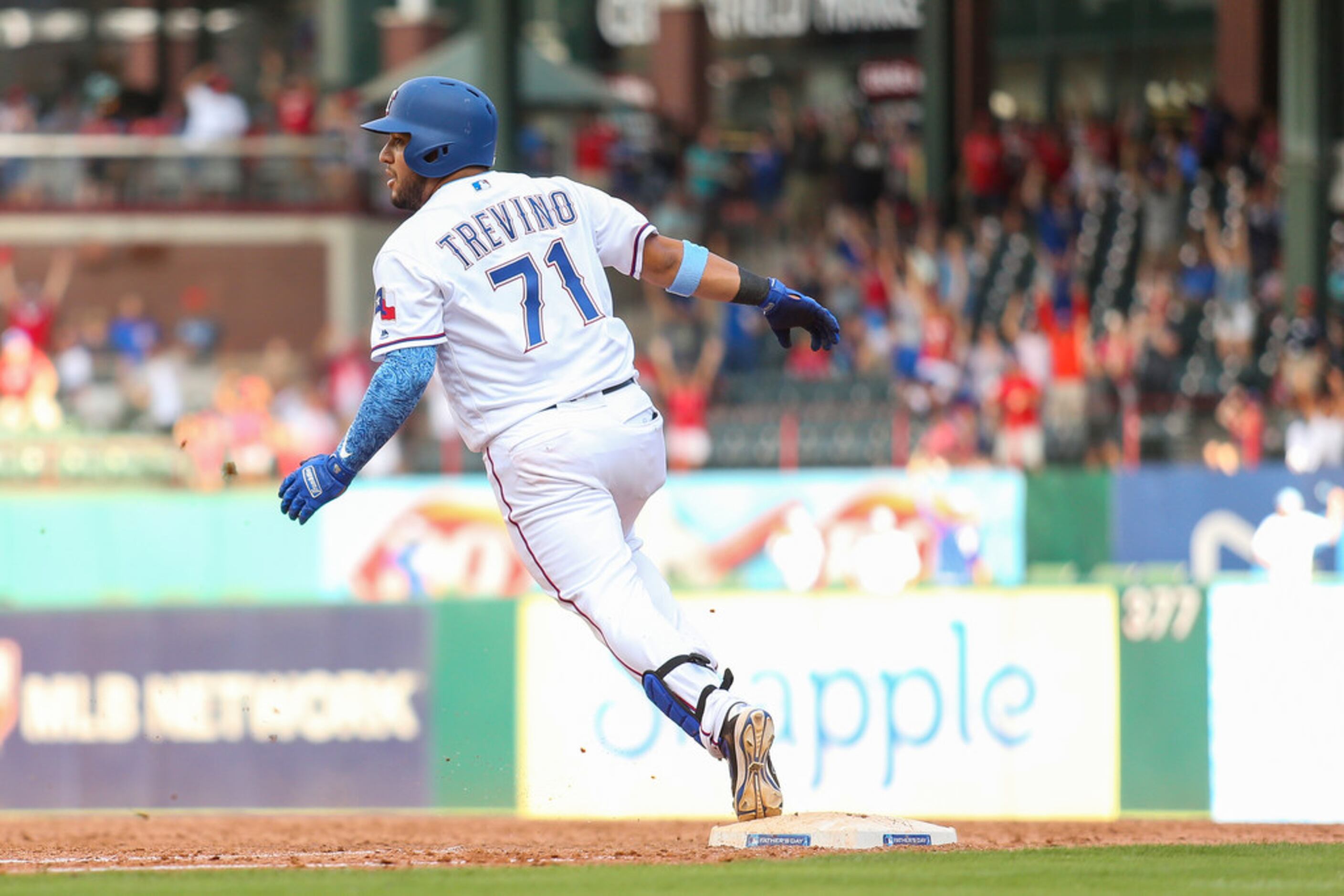 Texas Rangers' Jose Trevino grounds out against the Colorado