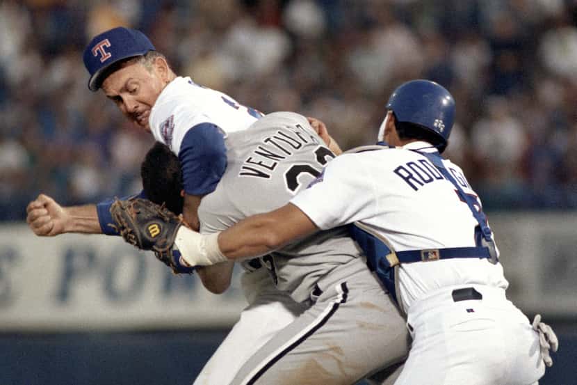 Chicago's Robin Ventura (in headlock) got the worst of it when he charged the Rangers' Nolan...