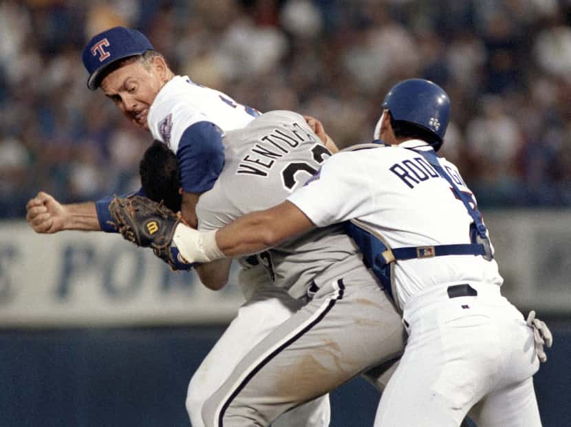Chicago's Robin Ventura (in headlock) got the worst of it when he charged the Rangers' Nolan...