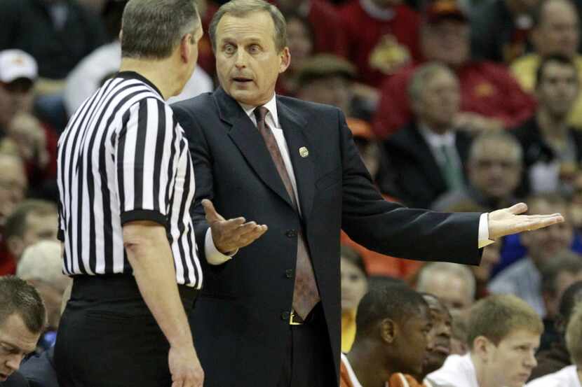 Texas coach Rick Barnes talks to an official as they played Iowa State during the...