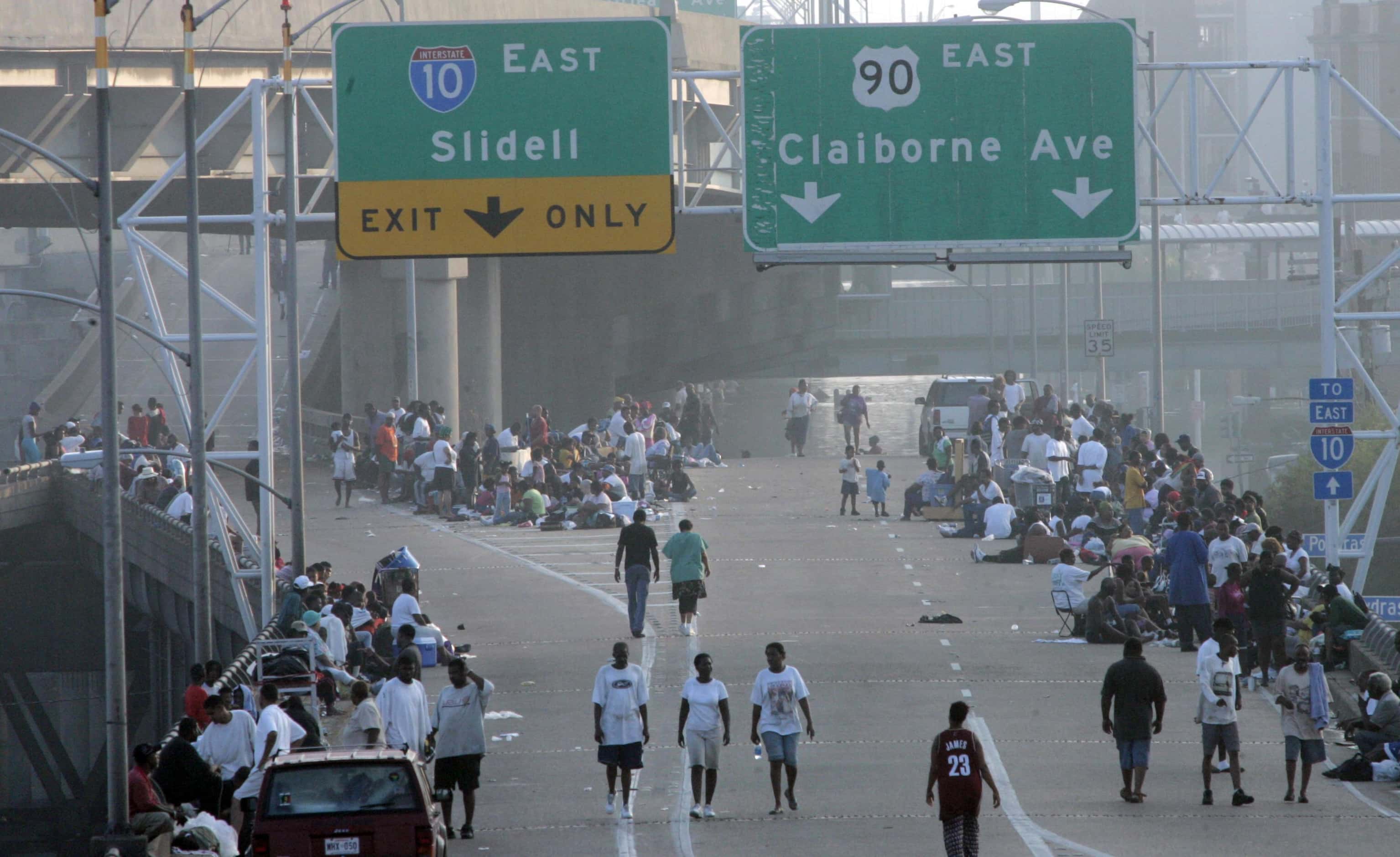 People wandered along Interstate 10 near the Superdome. Amid dire predictions, authorities...
