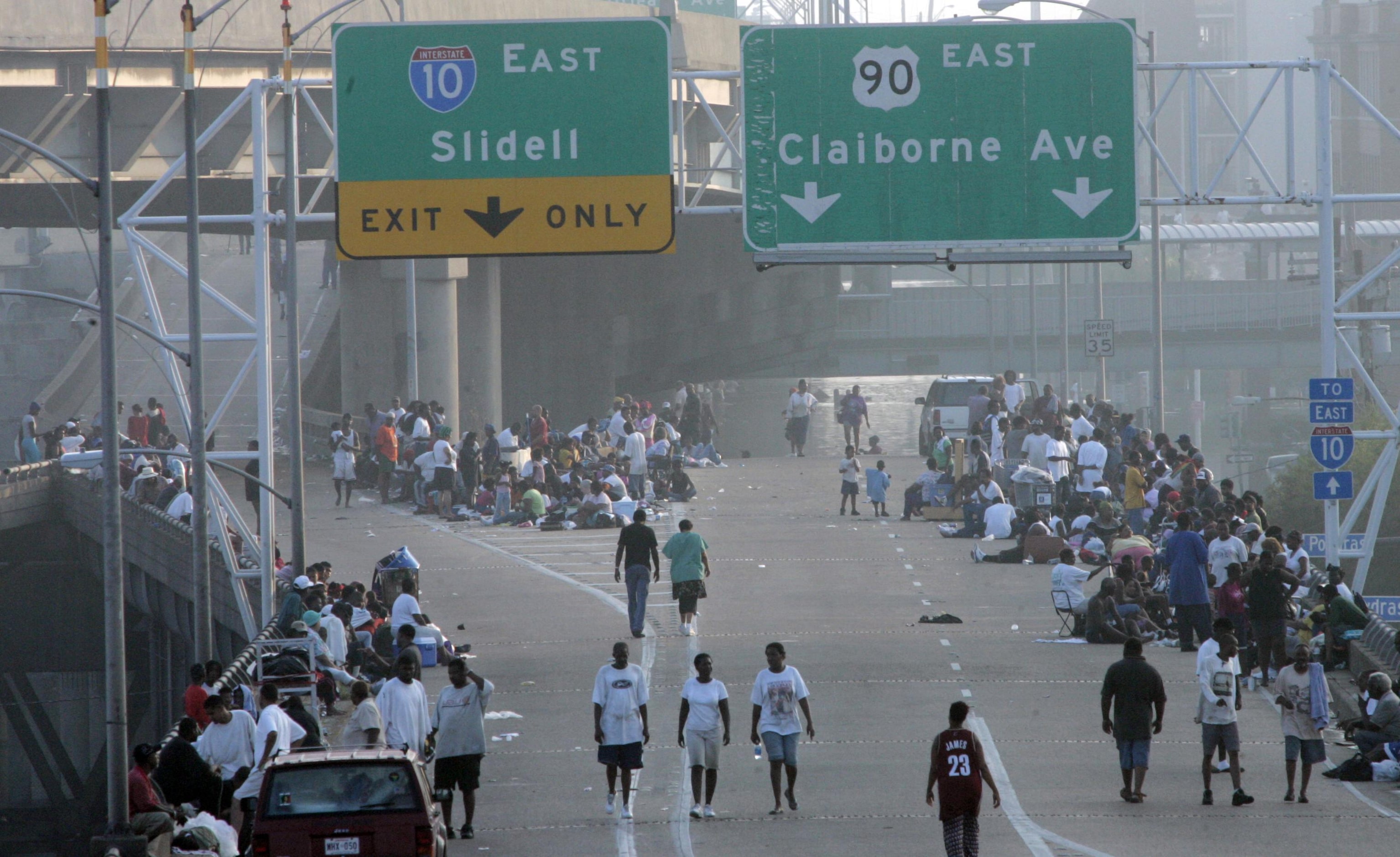 People wandered along Interstate 10 near the Superdome. Amid dire predictions, authorities...