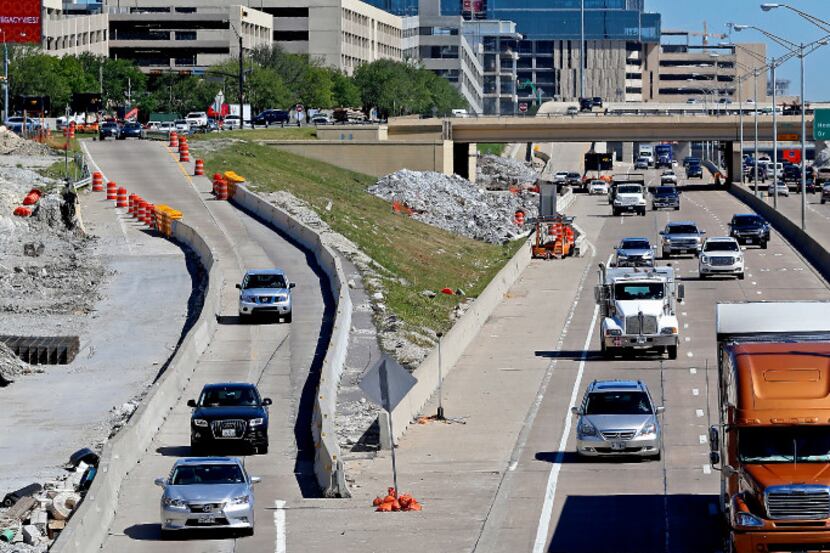 Traffic passes by on the Dallas North Tollway southbound near a Legacy Drive exit as part of...