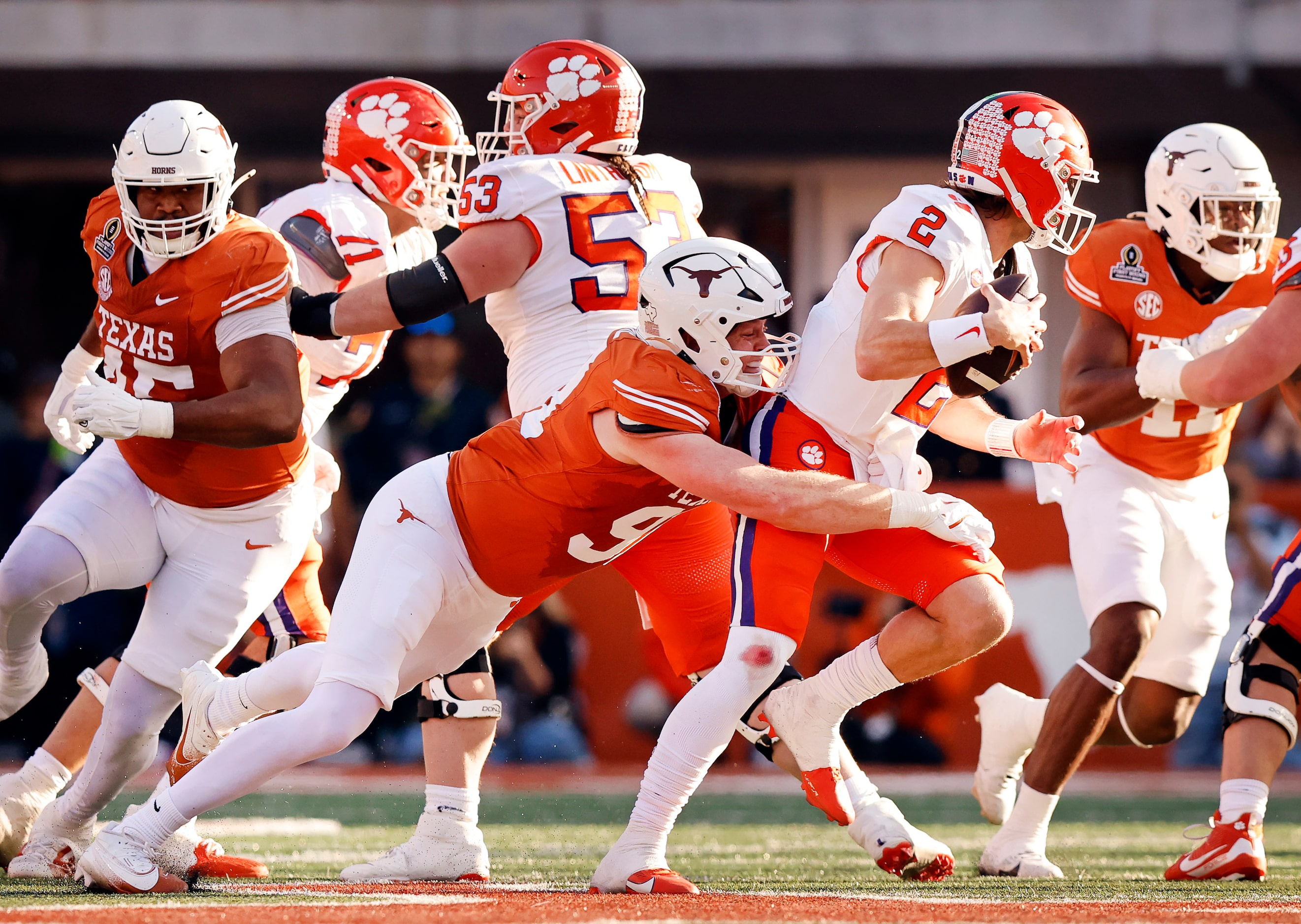 Texas Longhorns linebacker Ethan Burke (91) sacks Clemson Tigers quarterback Cade Klubnik...