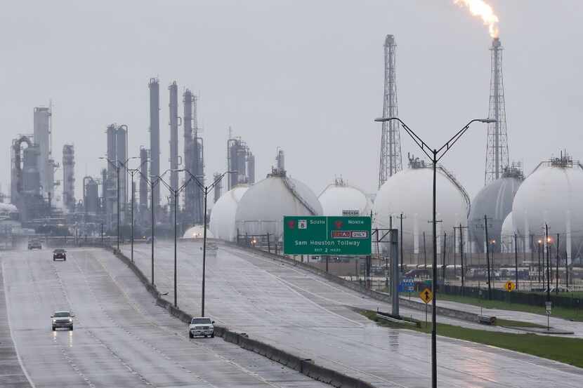 A flare at a Shell refinery is shown along with other complexes along Highway 146 Tuesday in...
