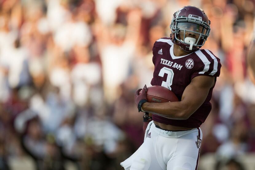 Texas A&M wide receiver Christian Kirk (3) turns into the end zone after catching a pass for...