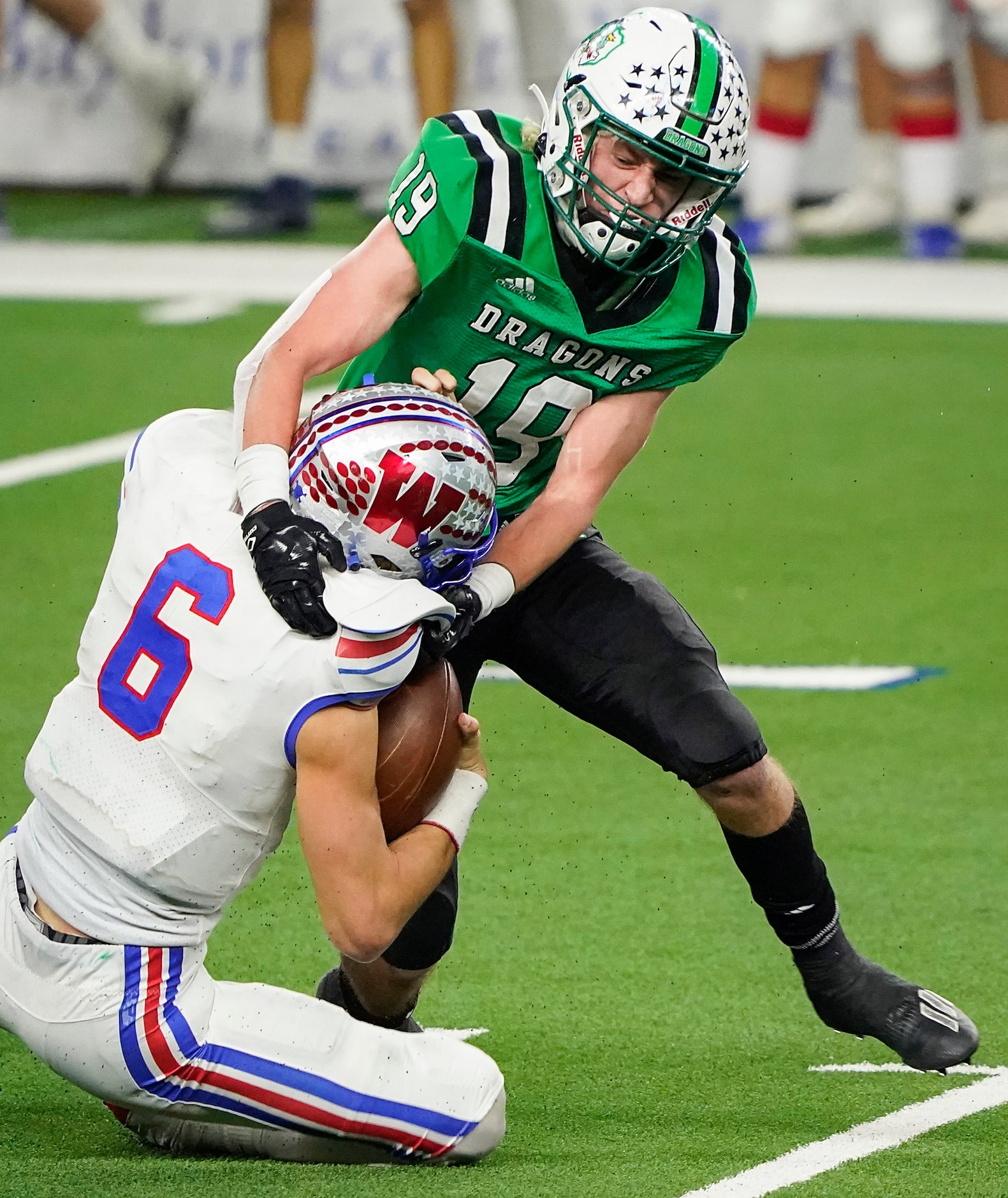 Austin Westlake quarterback Cade Klubnik (6) is sacked by Southlake Carroll defensive back...