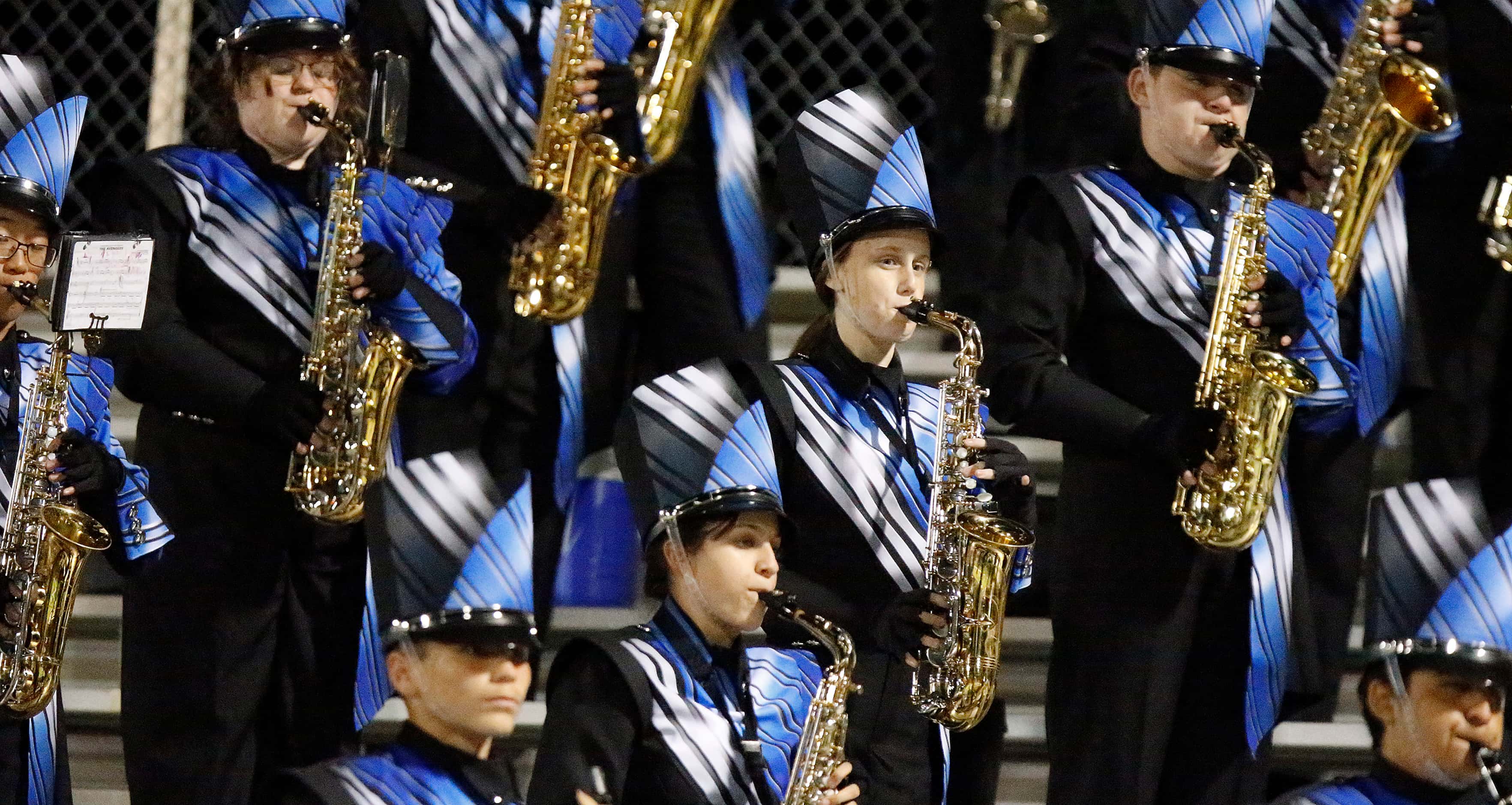 Members of the horn section play as the North Forney High School marching band performs...
