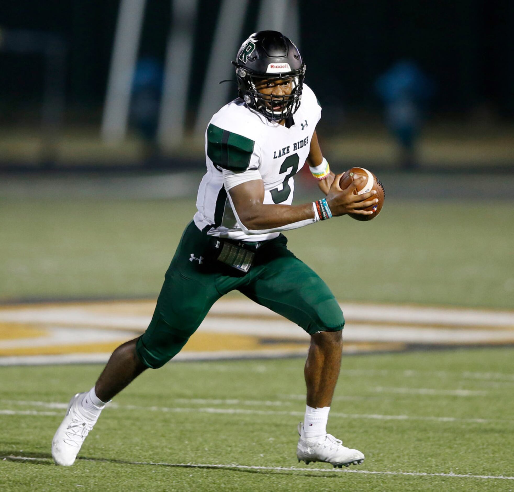 Mansfield Lake Ridge's Adrian Haawkins (3) looks to run in a game against DeSoto during the...