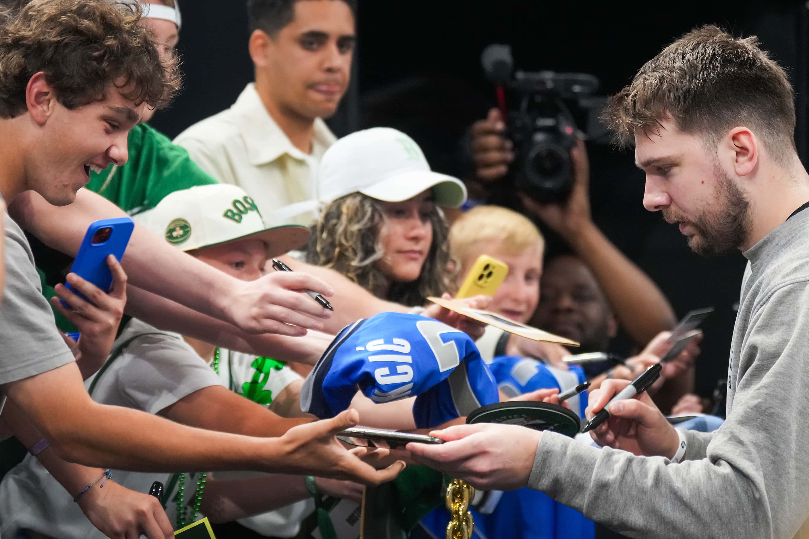 Dallas Mavericks guard Luka Doncic signs autographs before Game 5 of the NBA Finals against...