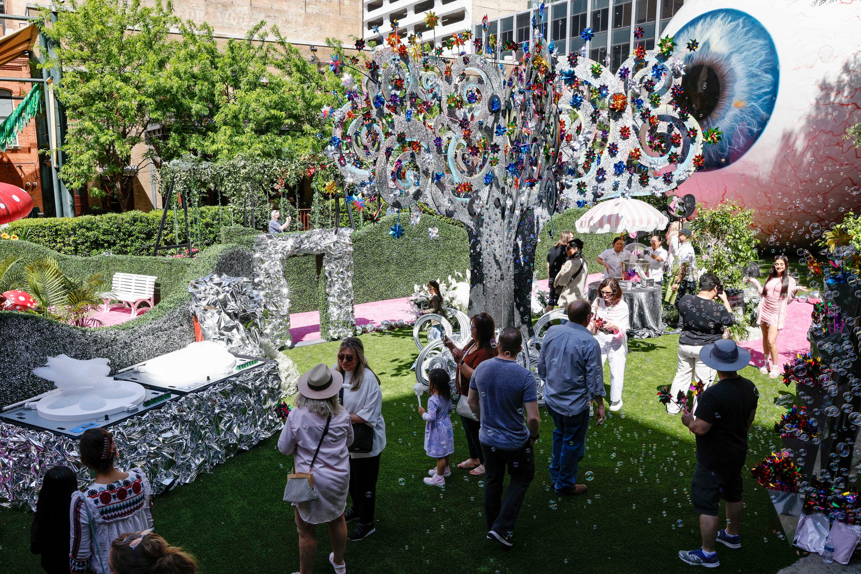 People walk through the Eyeboretum on Friday. The event is a celebration of the Dallas Art...