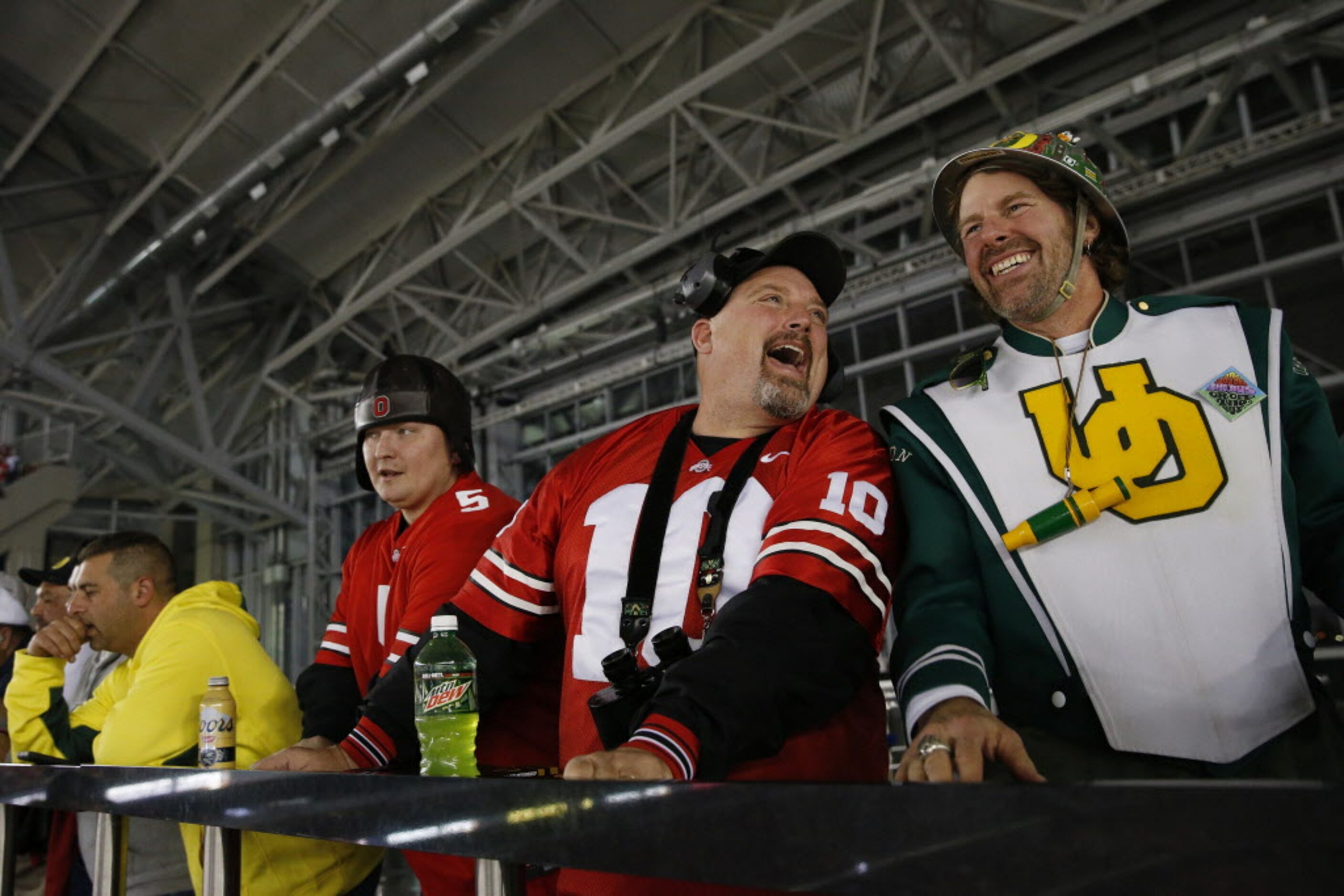 Ohio State Buckeyes fan Keith Garrison (left), of Clarkston, Michigan, jokes with Oregon...