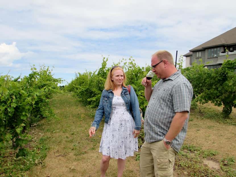 
Gretchen Kuhns and Jayson Miller tour the vineyard at Chateau Chantal Winery during their...
