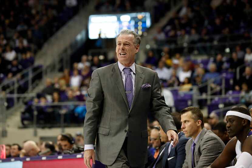 TCU head coach Jamie Dixon shouts at an official in the first half of an NCAA college...