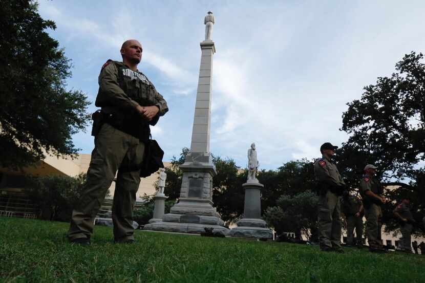Texas state troopers guarded the Confederate War Memorial before the March Against White...