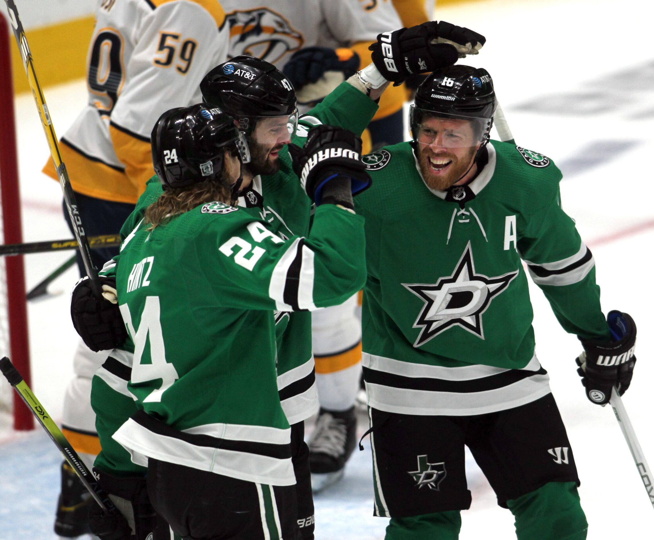 Dallas Stars forward Roope Hintz (24) ,left, set off a celebration with teammates Alexander...