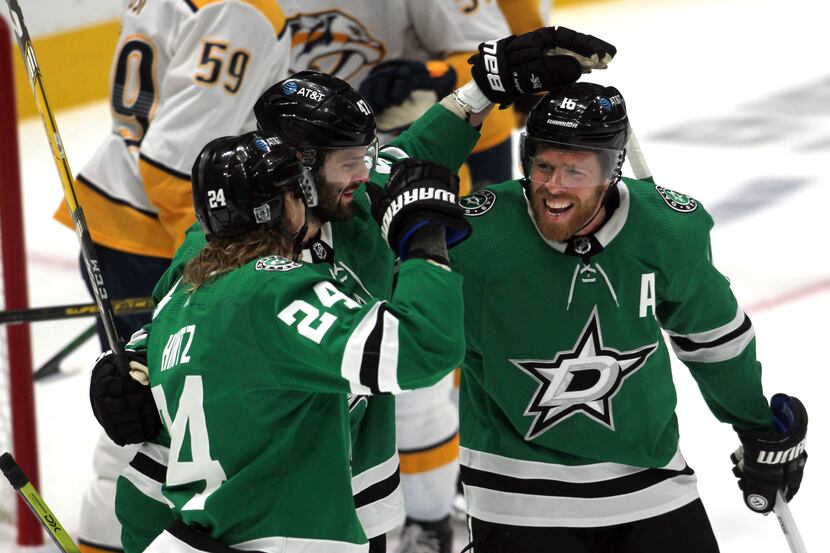 Dallas Stars forward Roope Hintz (24) ,left, set off a celebration with teammates Alexander...