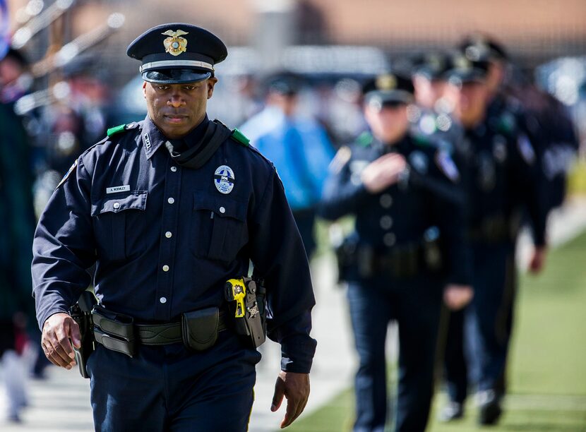  Officers make their way out of a memorial service for Euless police officer David Hofer.