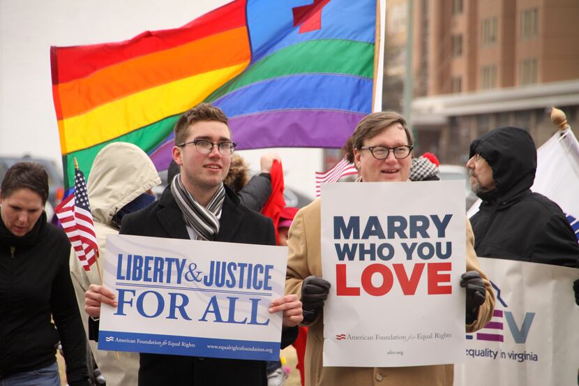 NORFOLK, VA - FEBRUARY 4:  Spencer Geiger (left) and Carl Johansen protest for equal...