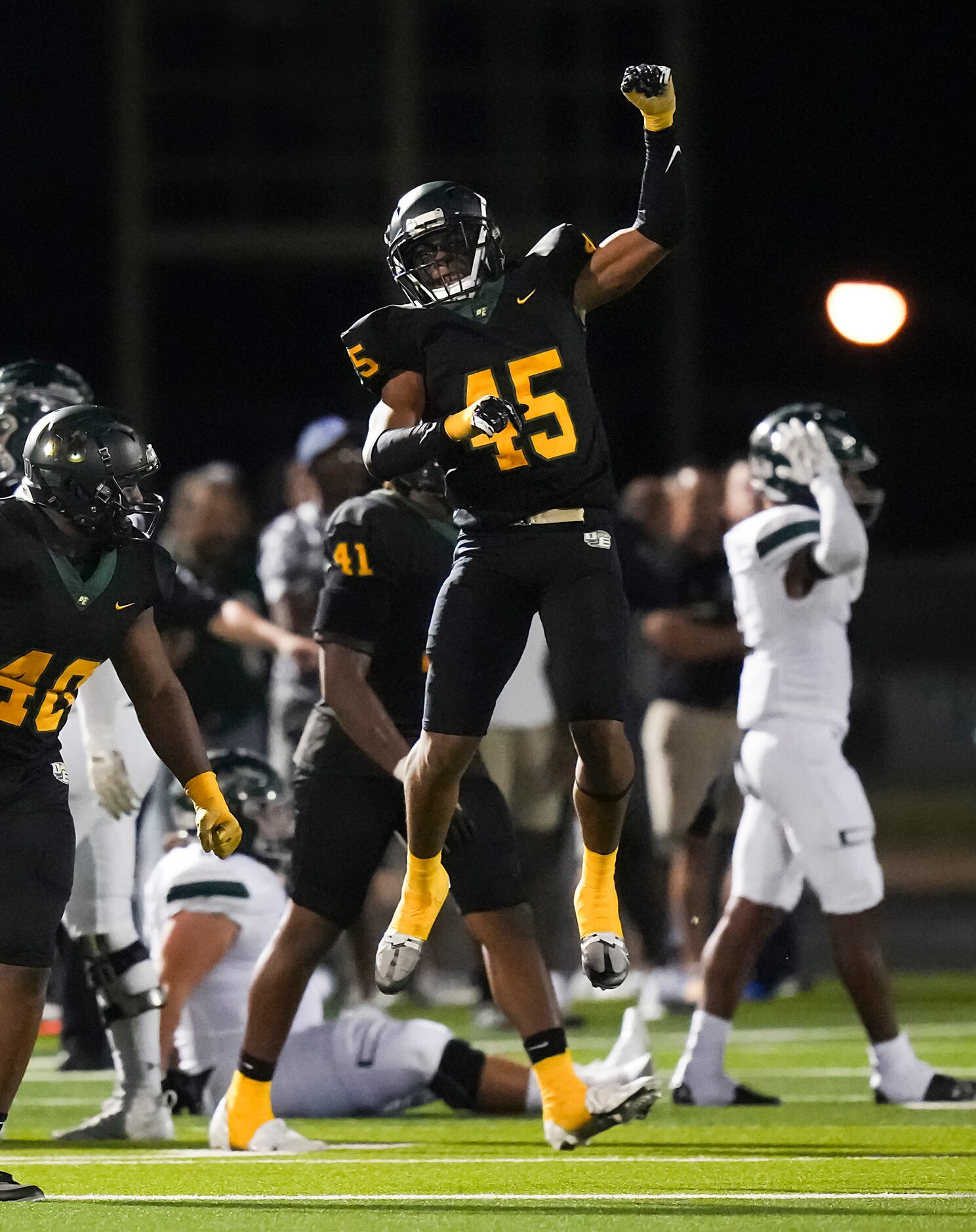 DeSoto defensive end Keylan Abrams (45) celebrates after dropping Waxahachie quarterback...