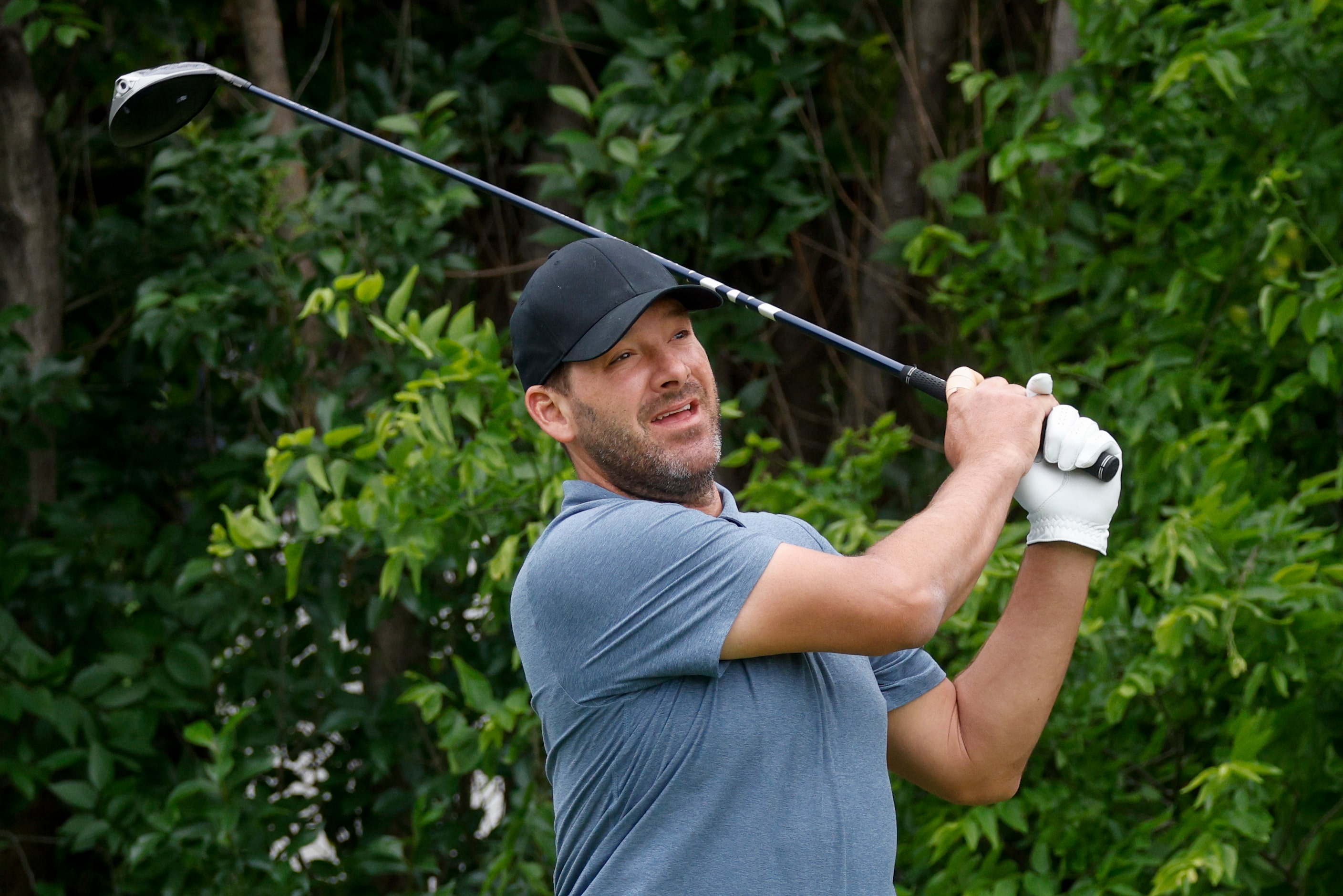 Former Dallas Cowboys quarterback Tony Romo watches his tee shot on the 18th hole during the...