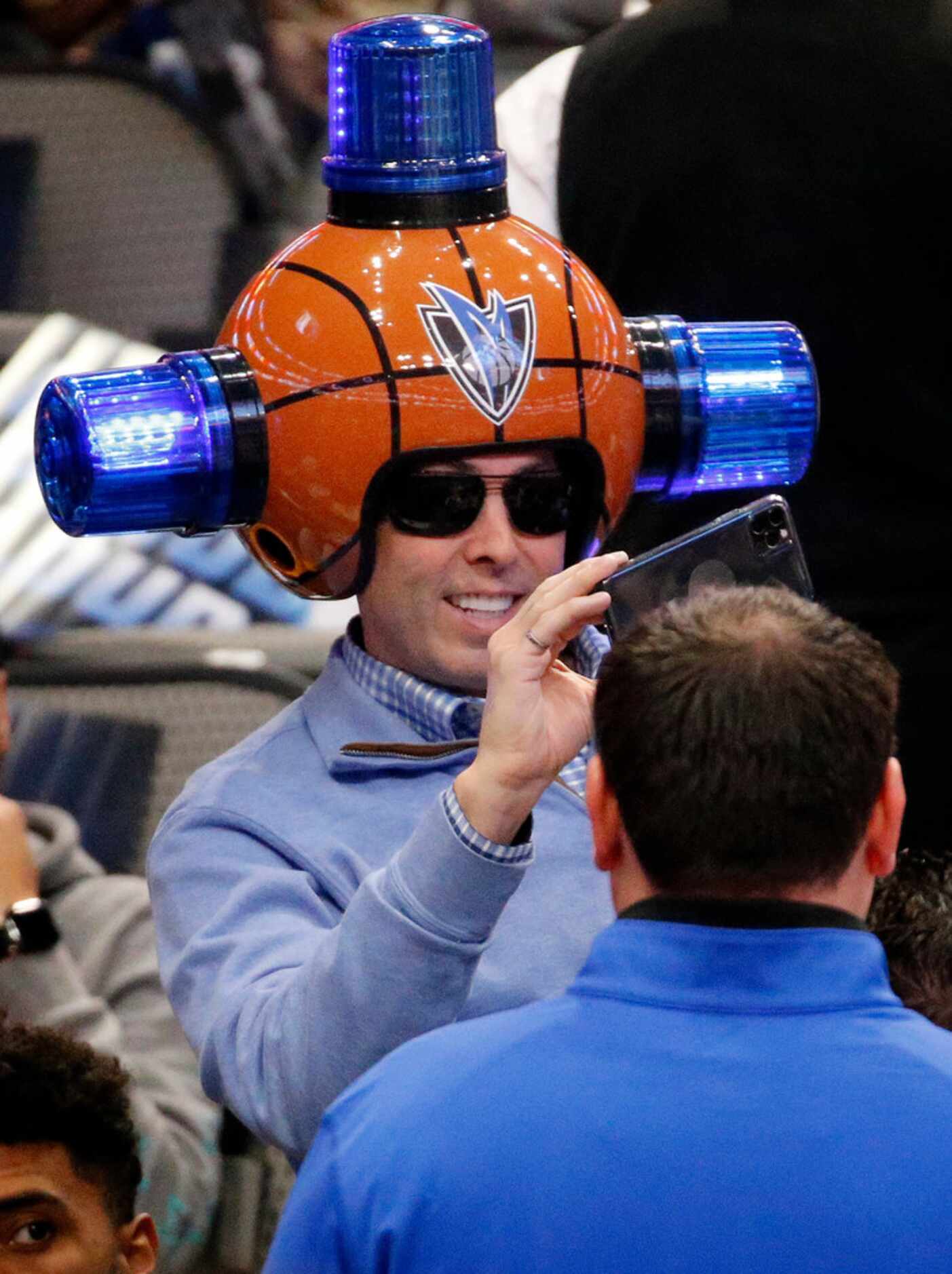Dallas Mavericks fan Gregg Wilson wore a basketball helmet with flashing blue lights to the...