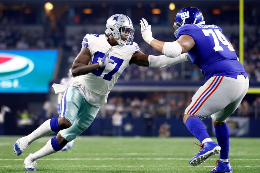 Dallas Cowboys rookie defensive end Taco Charlton (97) tries to get around New York Giants...
