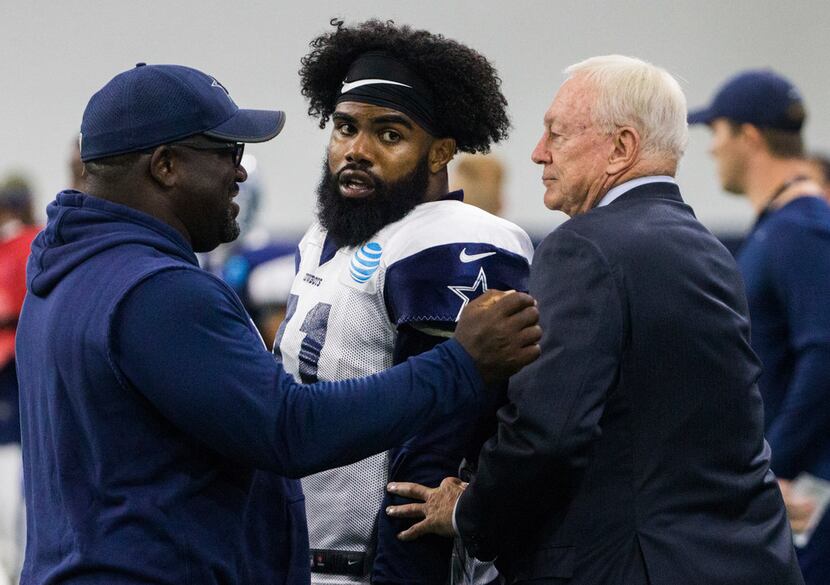 Dallas Cowboys running back Ezekiel Elliott (21) is greeted by Cowboys owner Jerry Jones...
