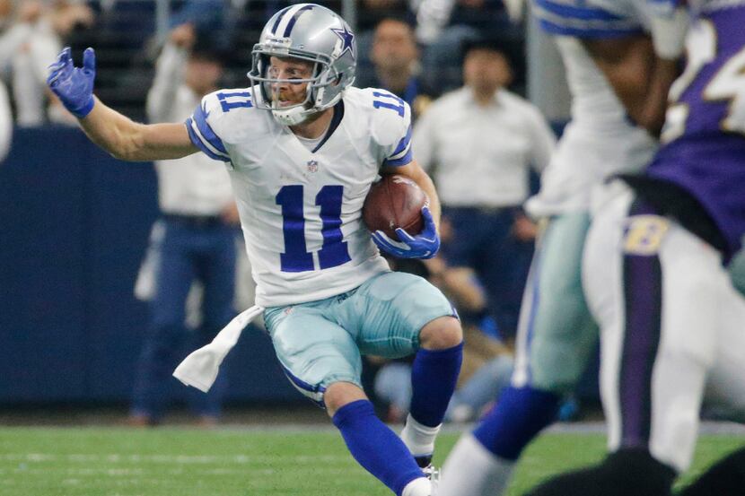 Dallas Cowboys wide receiver Cole Beasley (11) looks to gain more yardage after catching a...