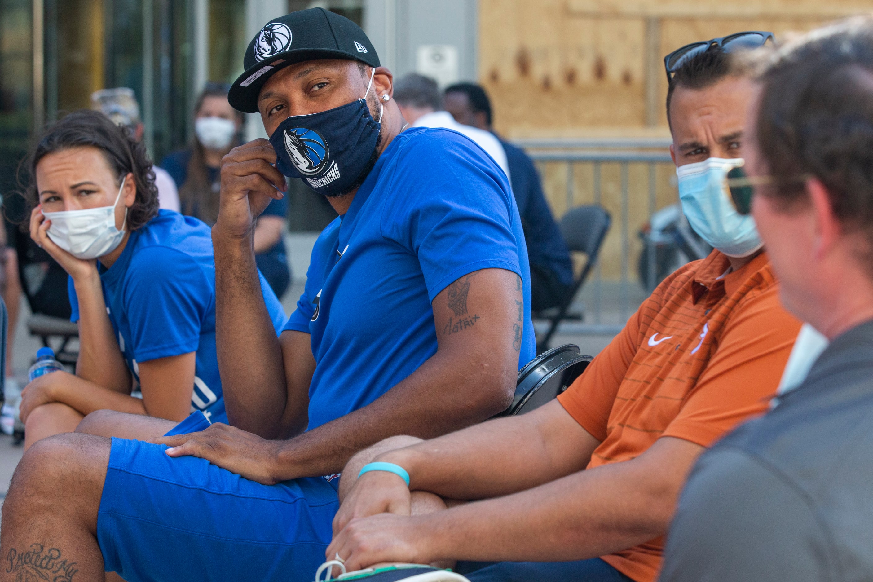 Former Dallas Mavericks player Shawn Marion (center left) and council member Adam Bazaldua...