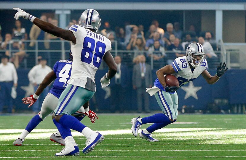 Dallas Cowboys wide receiver Dez Bryant (88) points for wide receiver Terrance Williams (83)...