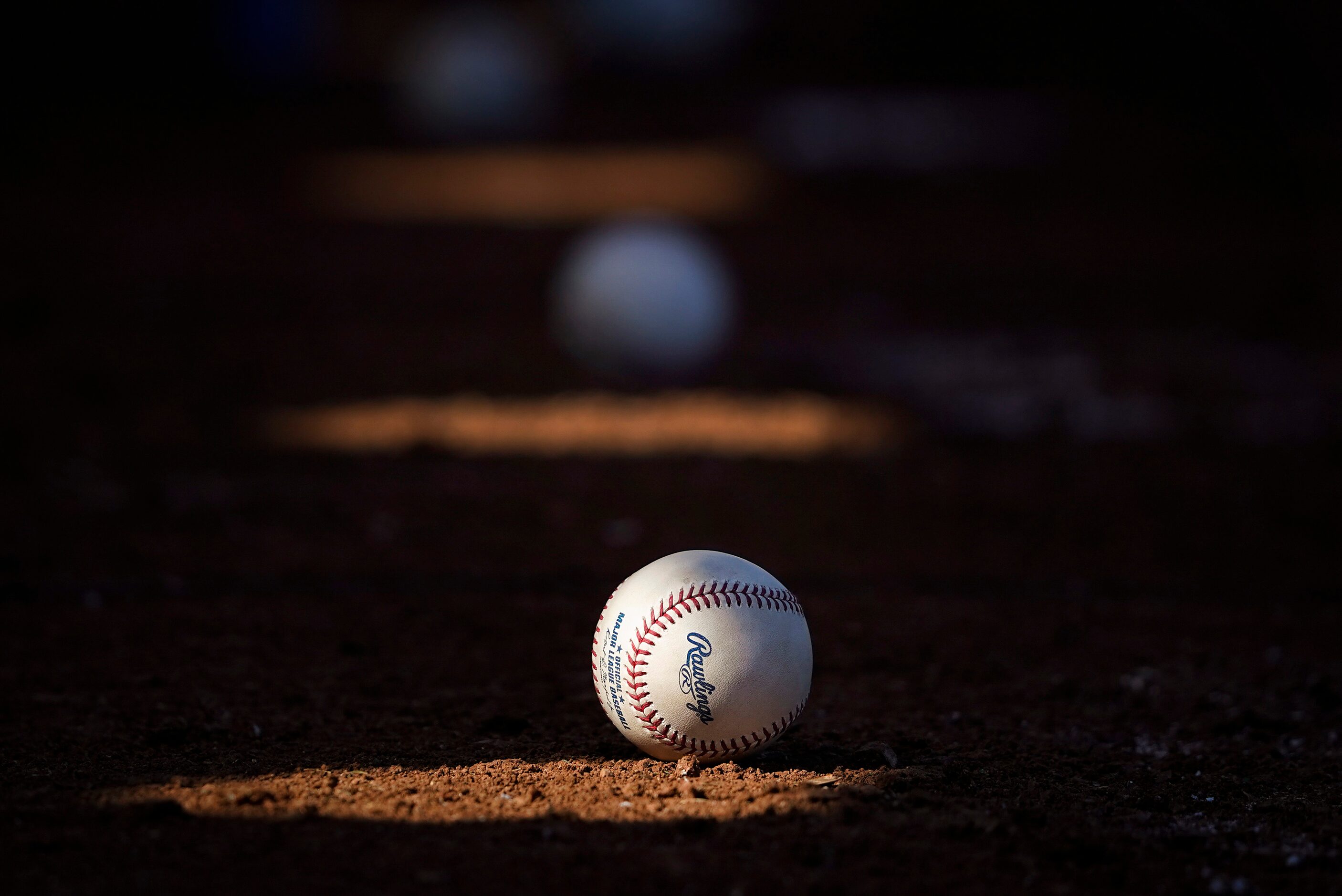 Baseball sit ready on a bullpen mound during the Texas Rangers first spring training workout...