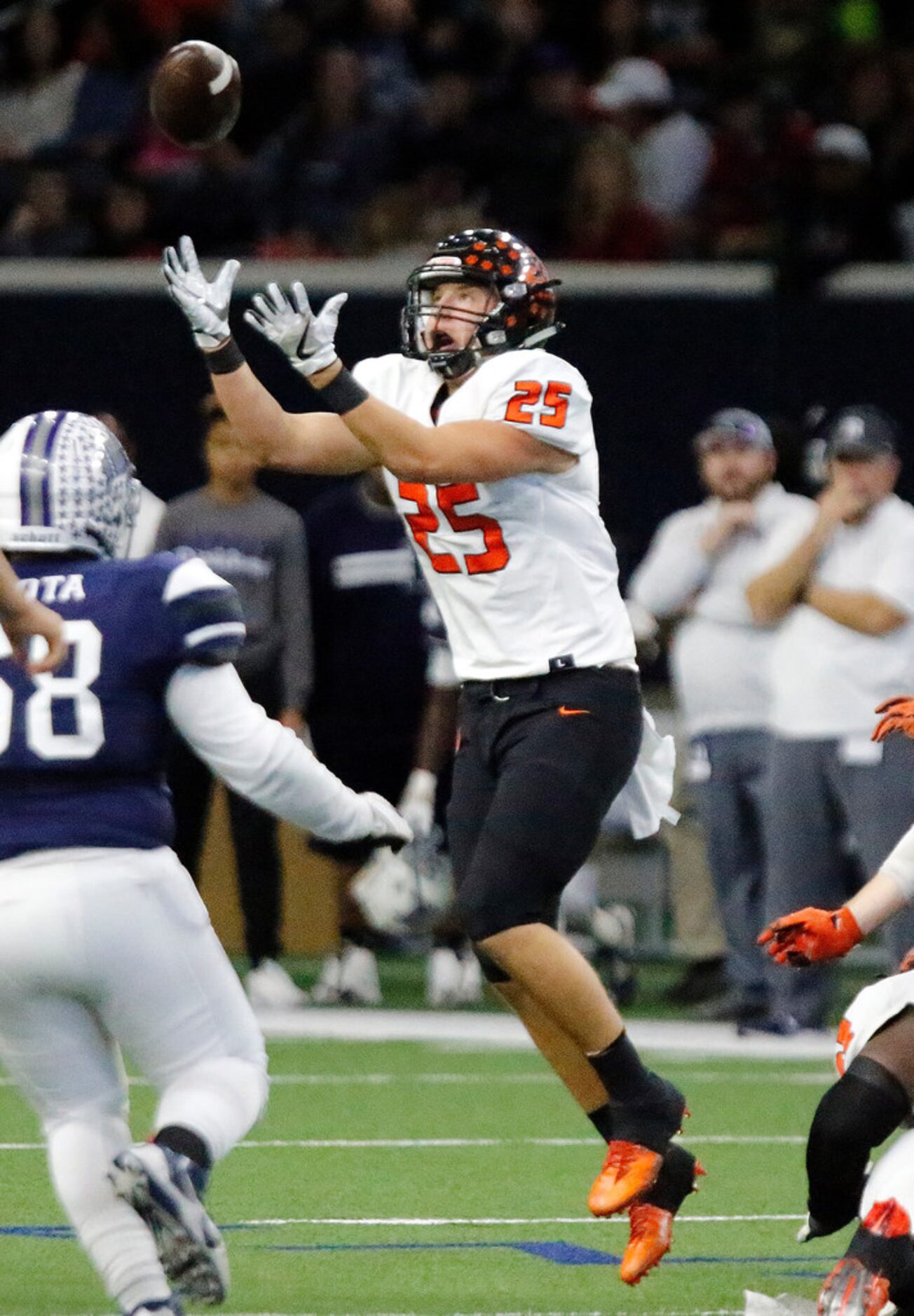 Aledo High School's Wyatt Harris (25) catches a fumble in the air during a kickoff during...