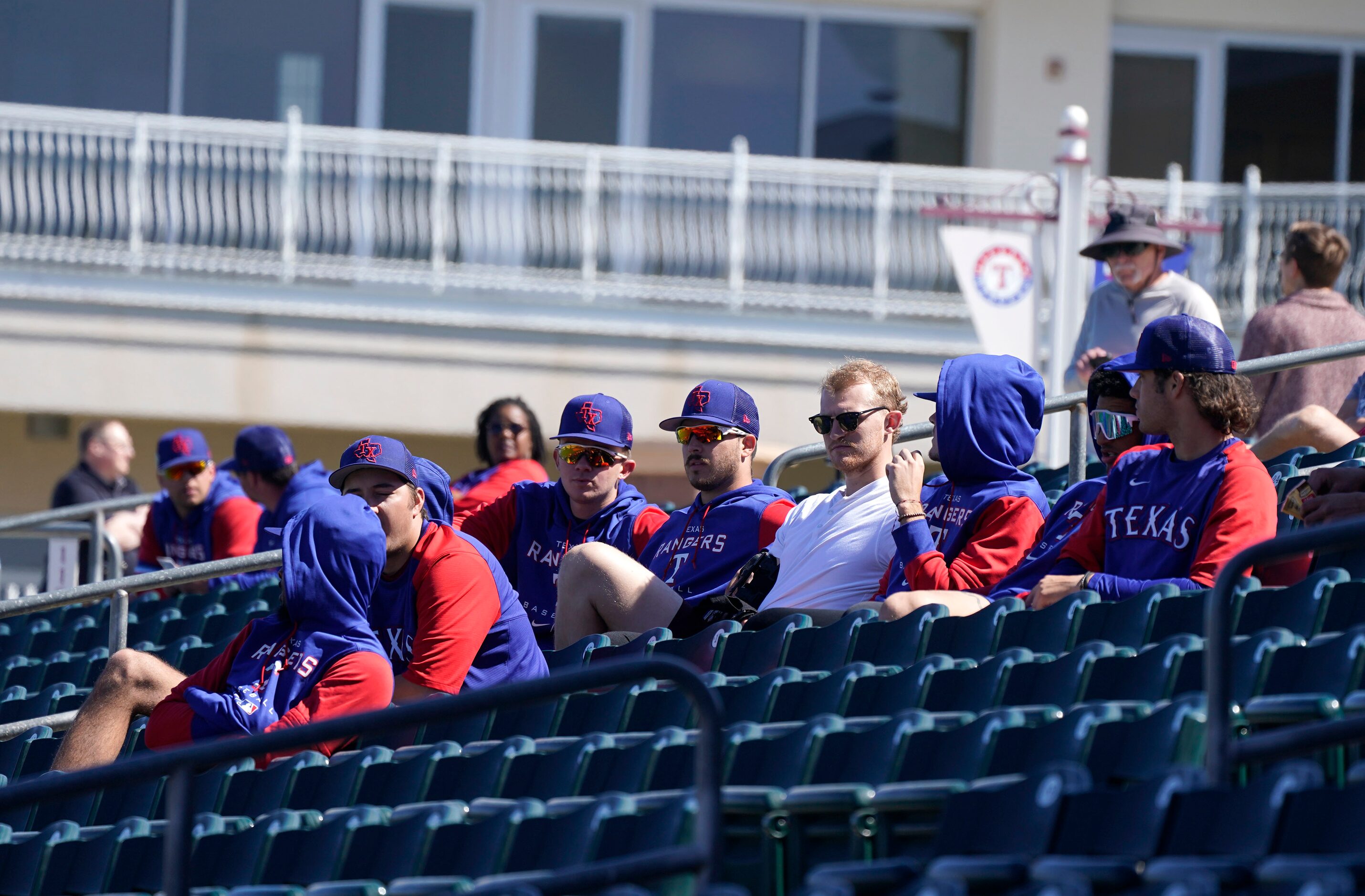 Baseball’s back and their fans and players are watching a minor league Spring Training game...