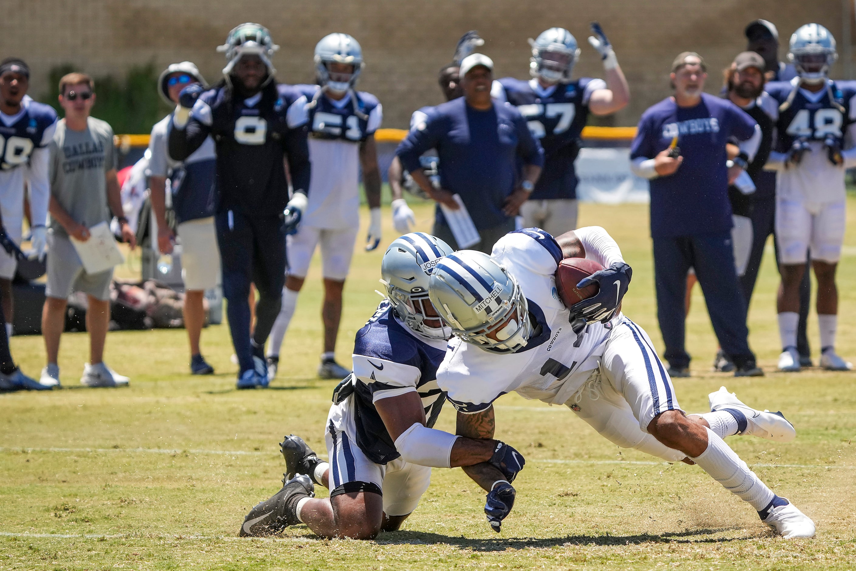 Dallas Cowboys wide receiver Osirus Mitchell (14) scores on touchdown pass past cornerback...