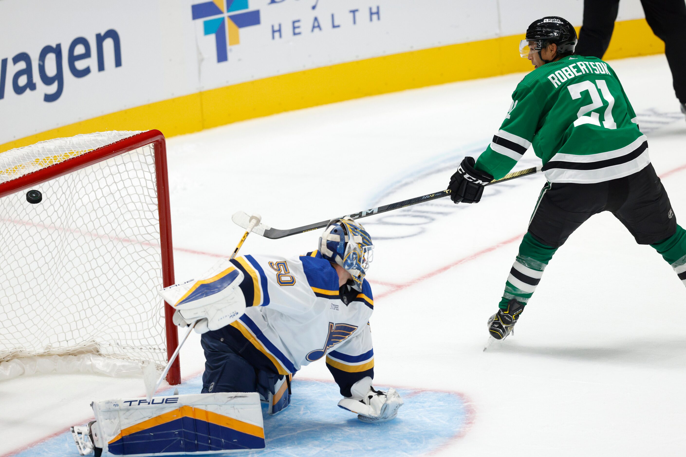 Dallas Stars left wing Jason Robertson (21) scores past St. Louis Blues goaltender Jordan...