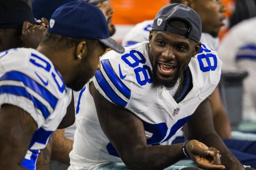 Dallas Cowboys wide receiver Dez Bryant (88) talks to middle linebacker Anthony Hitchens...
