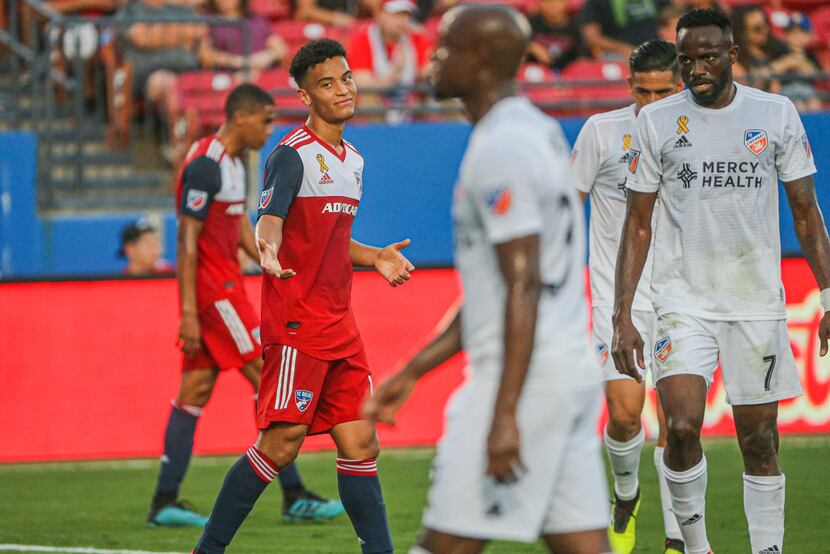 FC Dallas midfielder Brandon Servania (18) shrugs after missing a shot during the first half...