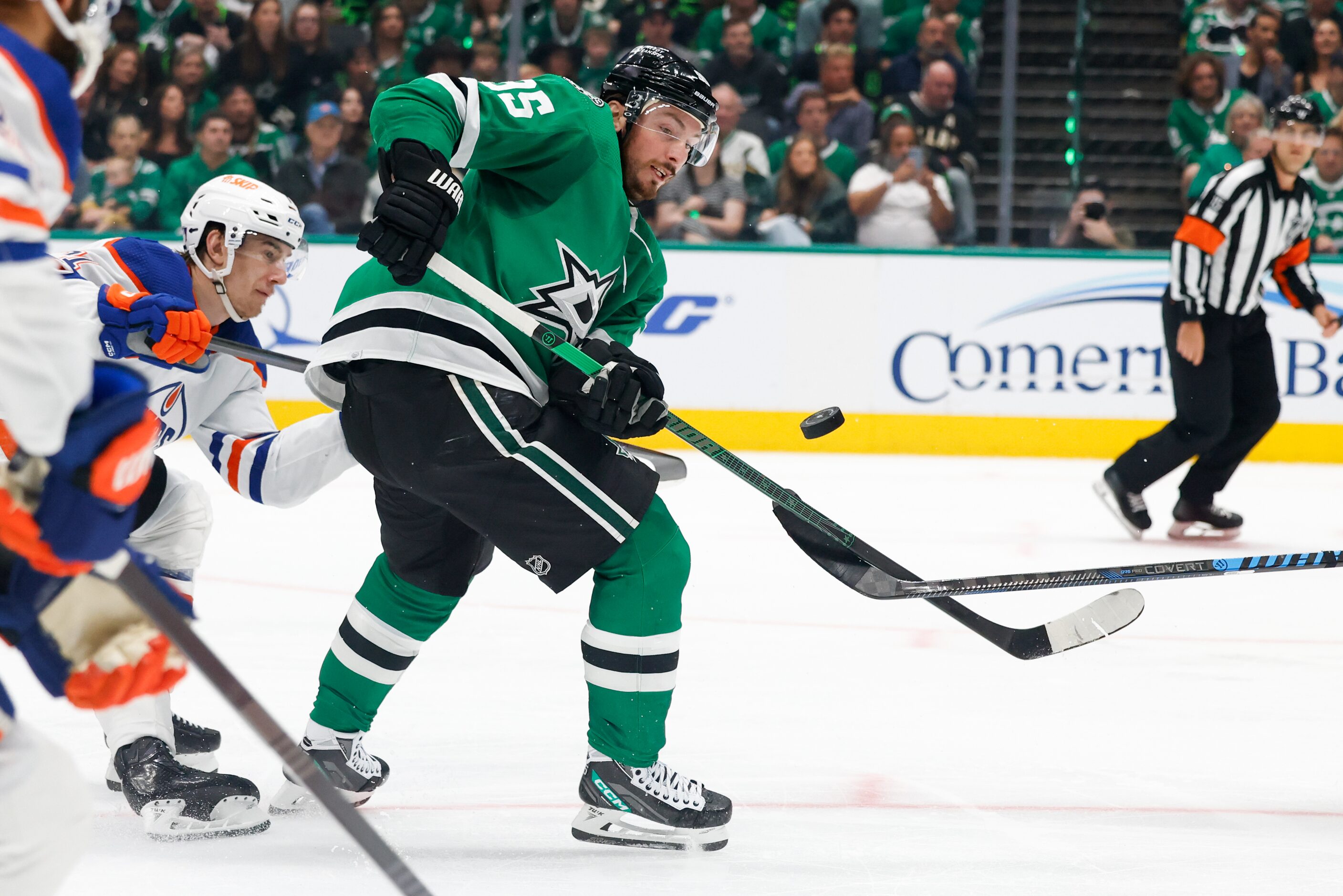 Dallas Stars center Matt Duchene (95) tries to wrangle a loose puck as he skates up ice...