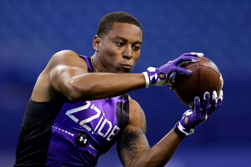 TCU defensive back Chris Hackett runs a drill at the NFL football scouting combine in...