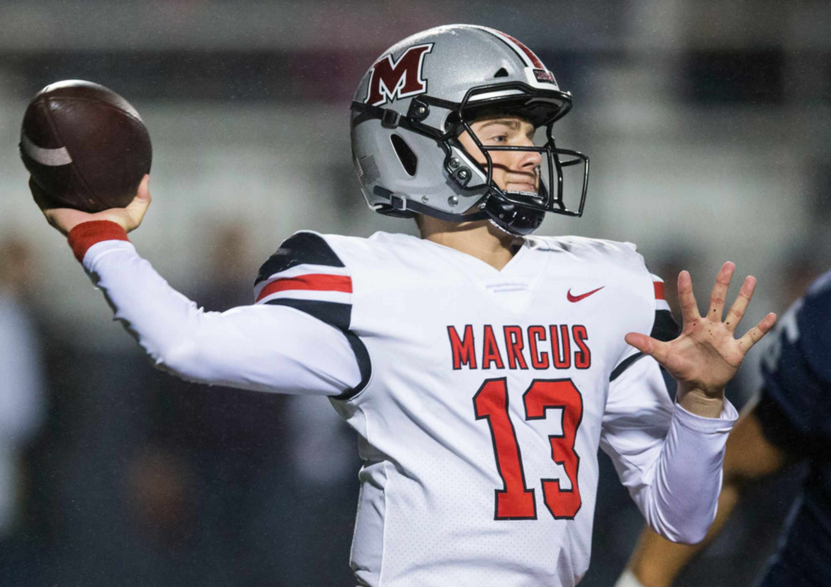 Flower Mound Marcus quarterback Garrett Nussmeier (13) throws a pass during the second...