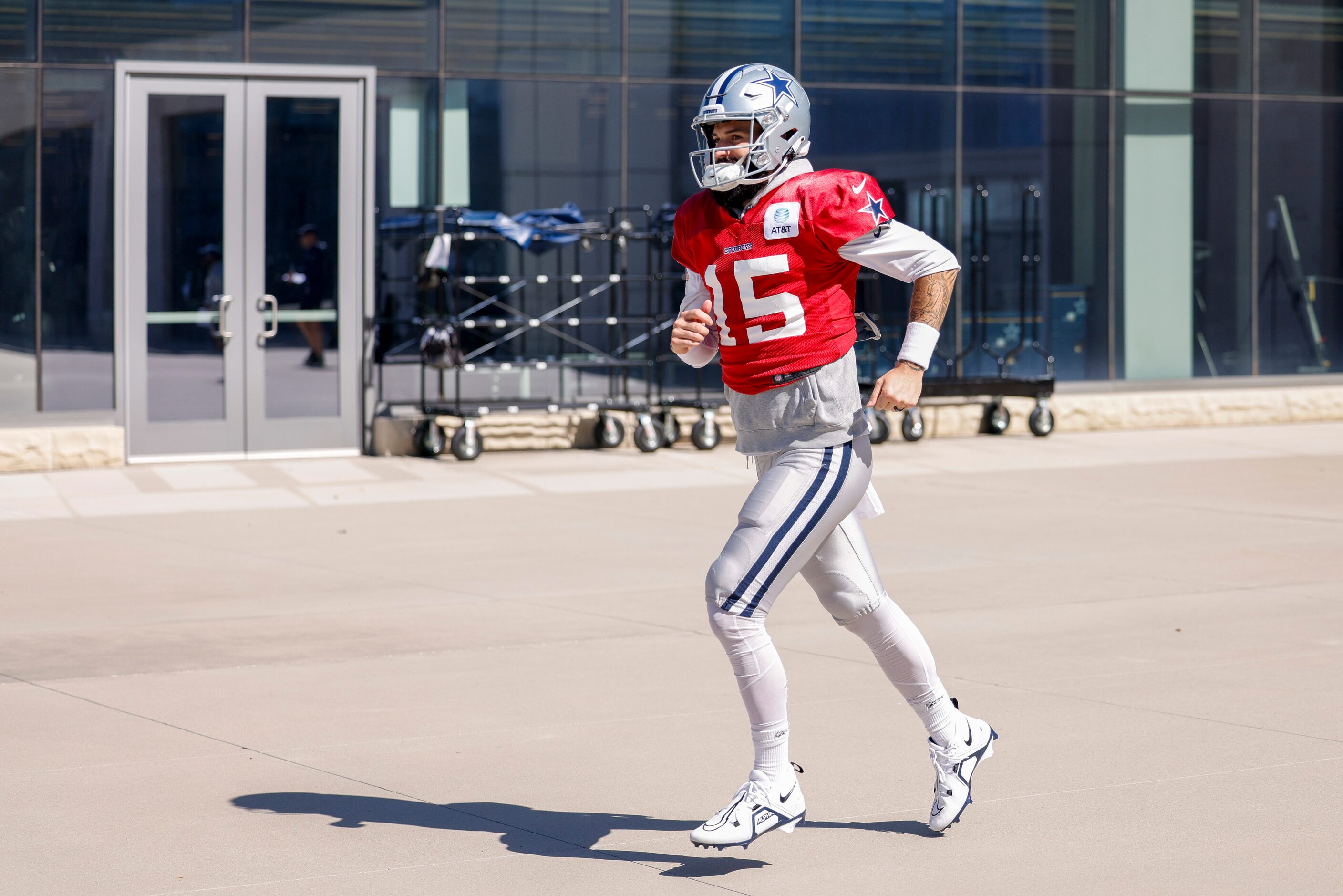 Dallas Cowboys quarterback Will Grier (15) jogs to the field during a practice at The Star,...