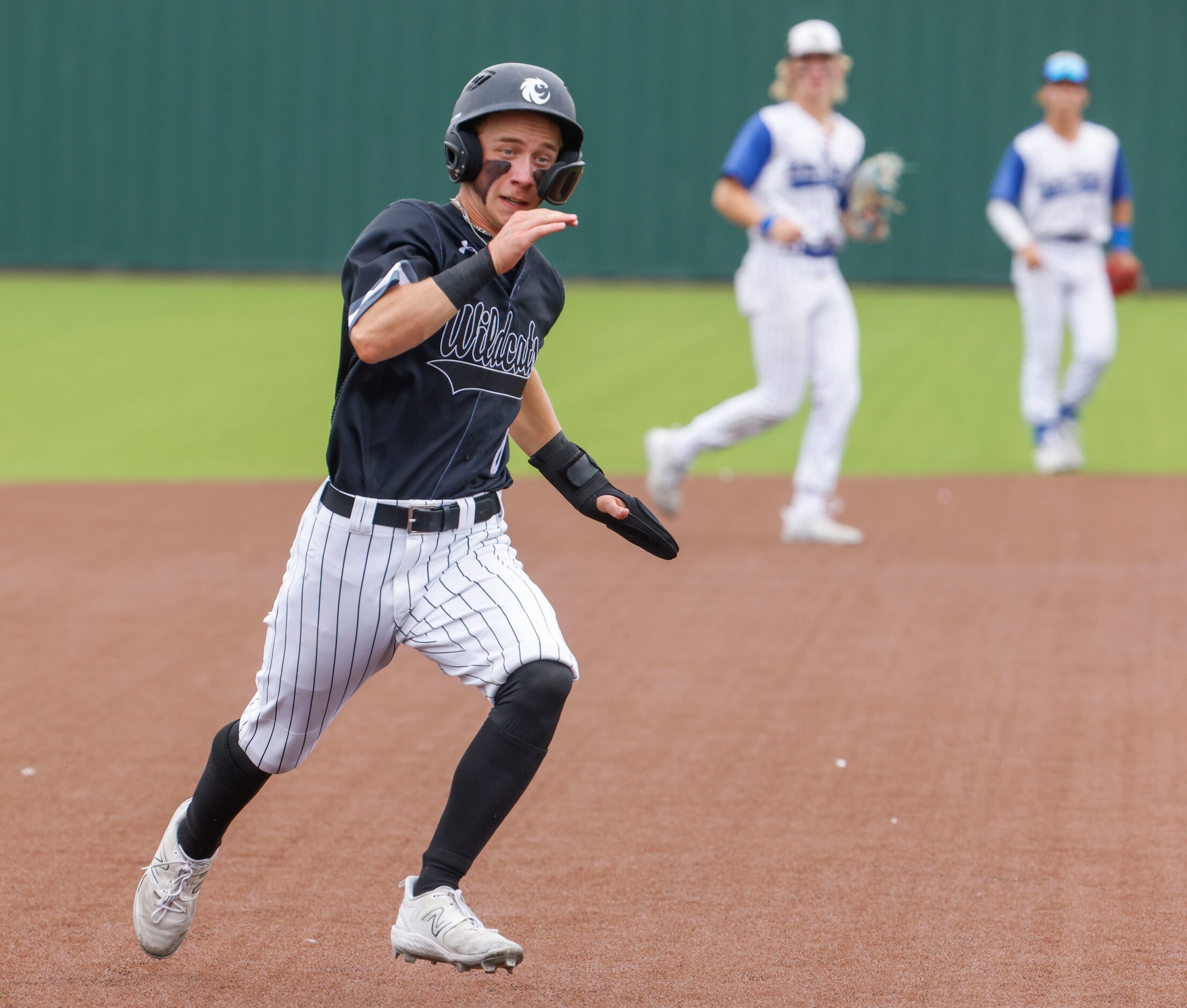 Denton Guyer’s Blade Carver runs to the third base during the fifth inning of a baseball...