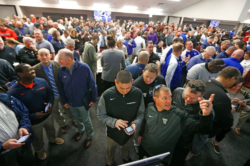 Coaches gather to see the district breakdown during the UIL alignment announcement at...