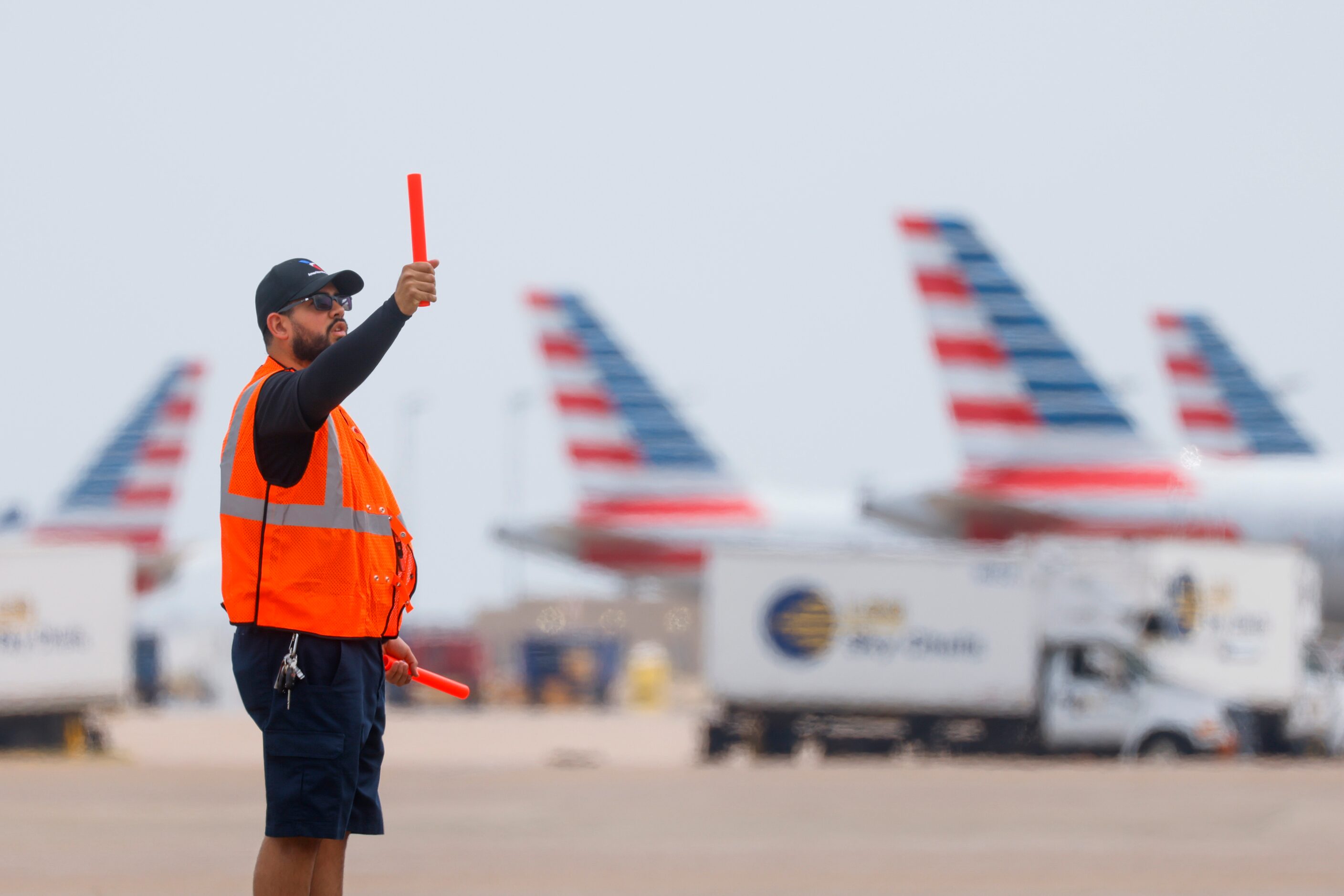 Members of the ground crew direct an American Airlines flight on Tuesday, May 9, 2023 at DFW...