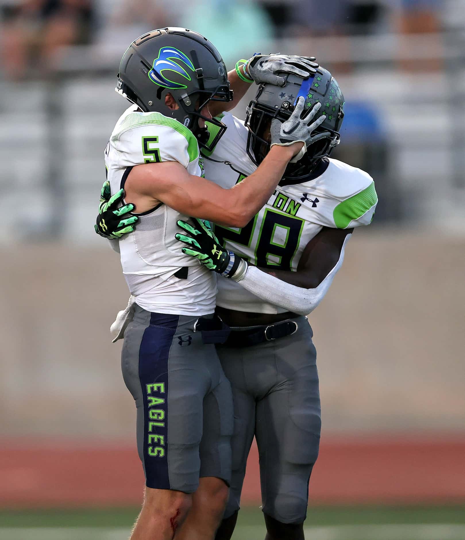 Eaton running back Demarion Williams (28) celebrates with wide receiver Mason Stubbe (5)...
