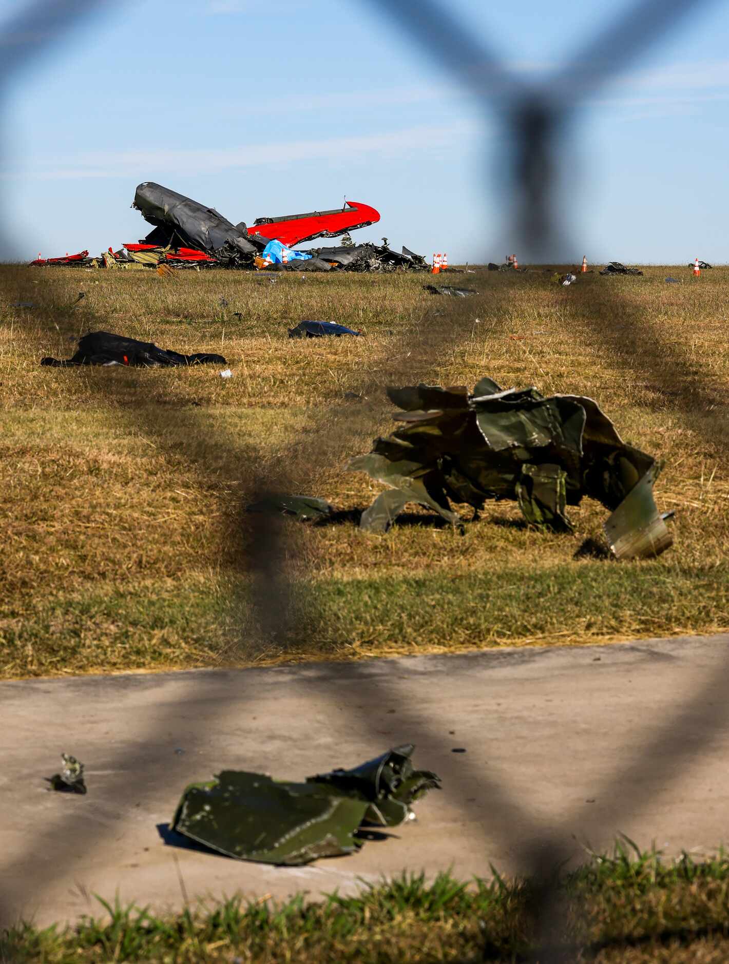 Debris lays across the open field at the Dallas Executive Airport on Sunday, Nov. 13, 2022,...