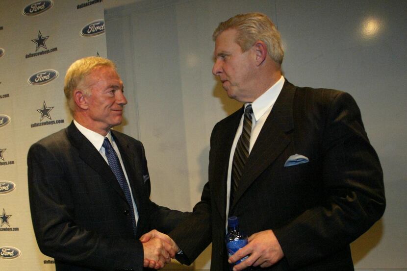 Cowboys owner Jerry Jones (left) shakes hands with his new head coach, Bill Parcells...
