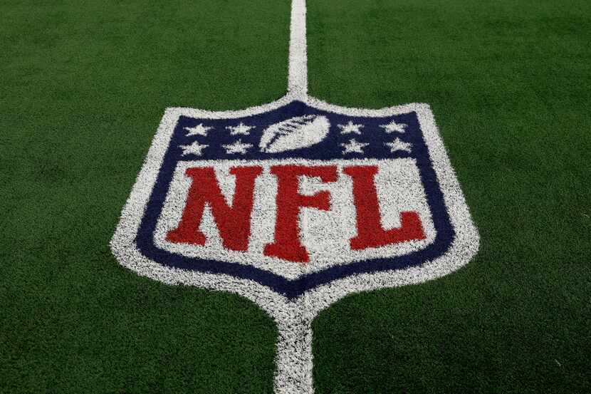 The NFL shield logo on the field before an NFL football game between the Detroit Lions and...